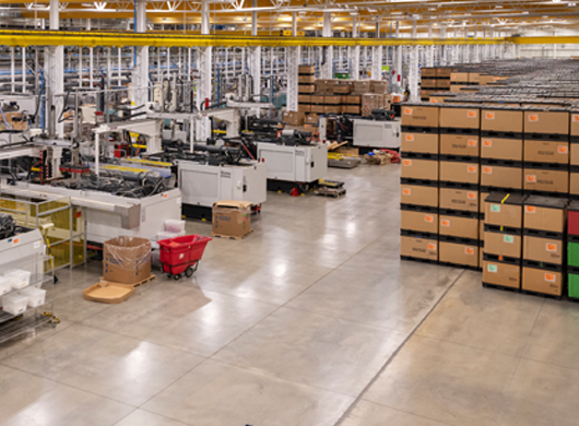 Tessy plant floor with machines boxes